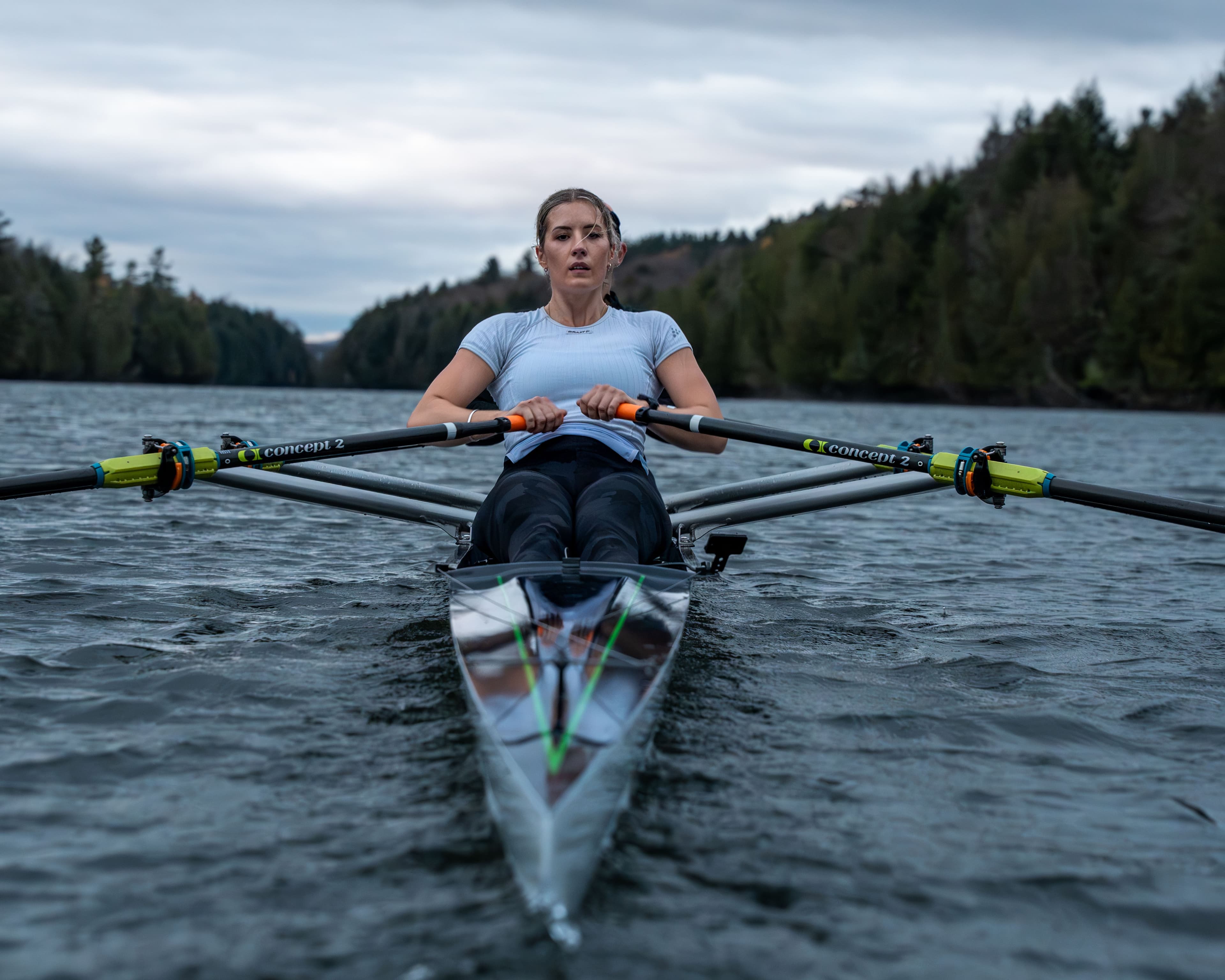 two women rowing on water with concept2 comp blades in a double